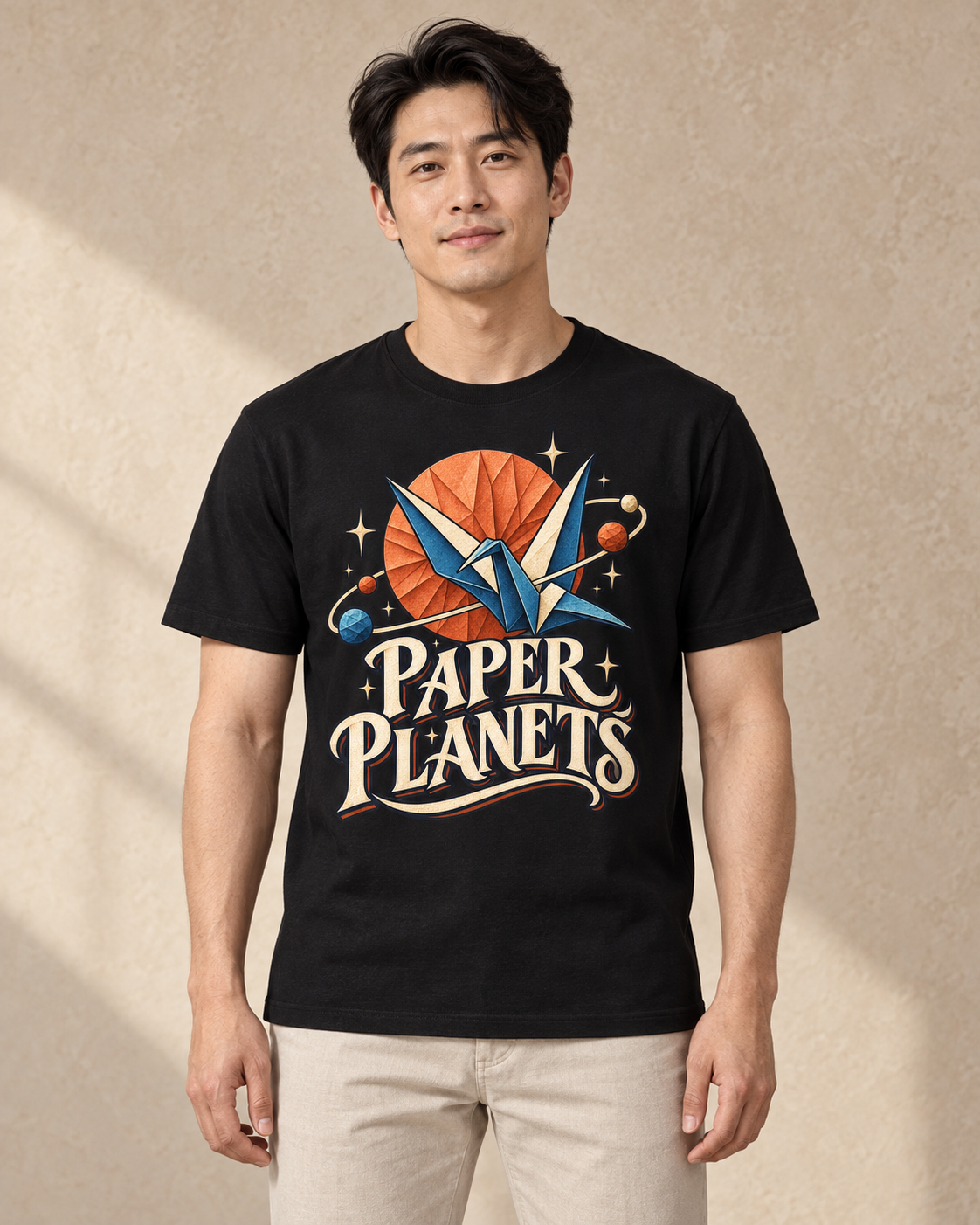Paper Planets graphic on a Black regular-fit T-shirt, model front view