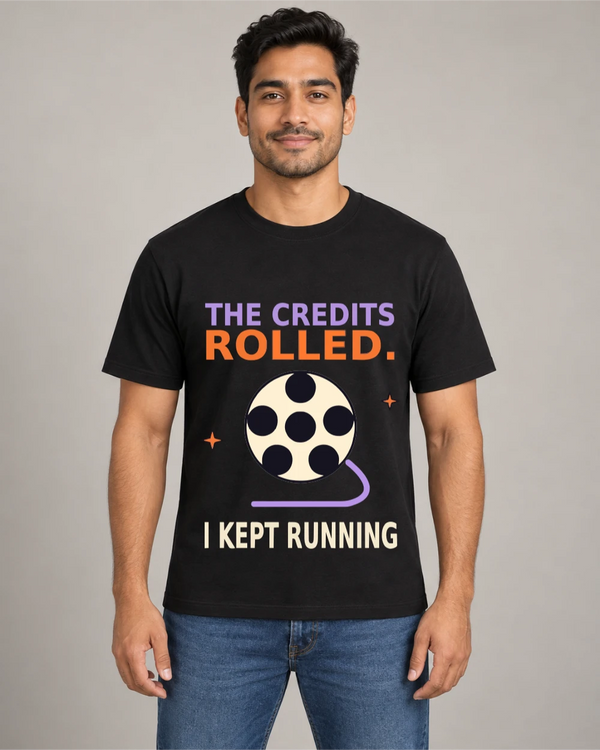 Model wearing The Credits Rolled on a black T-shirt